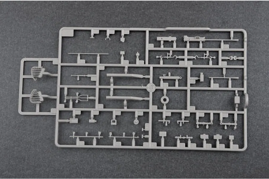 A grey plastic sprue containing various small model tank parts for a 1/35 scale model kit.