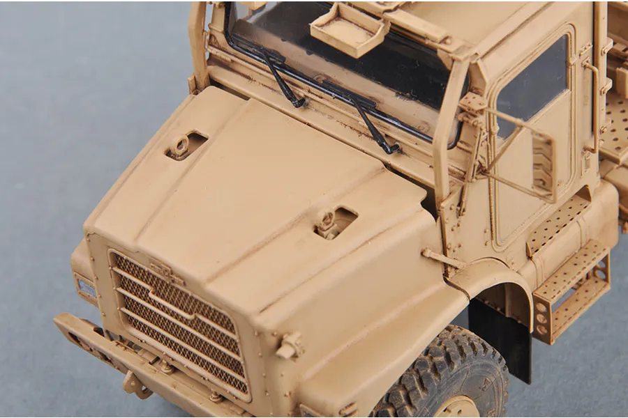 High-angle close-up of a tan-colored 1/35 scale plastic model of a US MK.23 MTVR military truck.