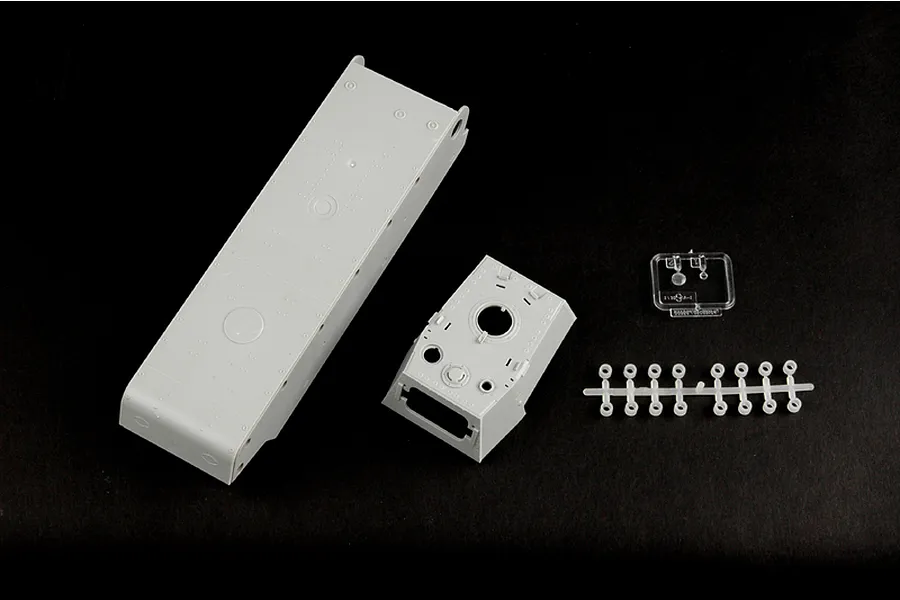 Unassembled plastic model kit parts for a 1/35 scale Soviet KV-8 tank, including the hull, turret, and small clear and grey sprue components.