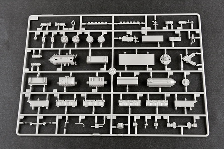A grey plastic sprue containing various unpainted model kit parts for the Trumpeter 1/35 Russian AT-T Artillery Prime Mover.