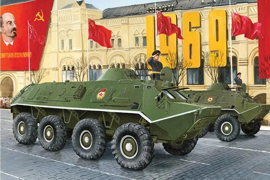 Box art illustration of two green BTR-60PB armoured personnel carriers driving past a building with Soviet flags and a portrait of Lenin.