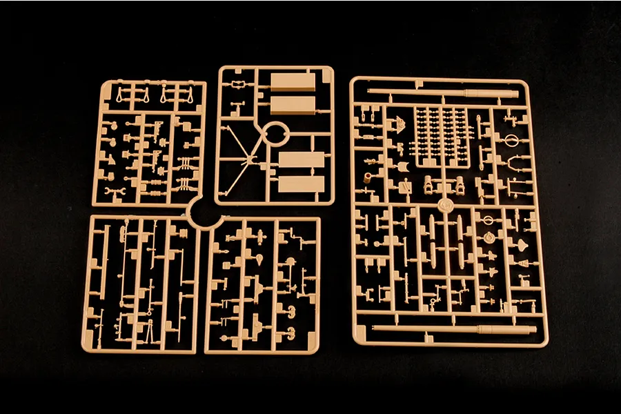 Tan plastic model kit sprues for a 1/35 scale military vehicle on a black background.