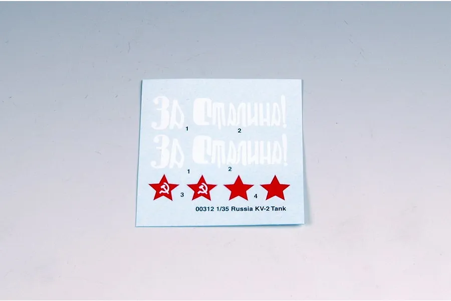 A decal sheet for a 1/35 scale Trumpeter Russian KV-2 tank model kit, featuring white Cyrillic text and red star insignias on a light blue backing.