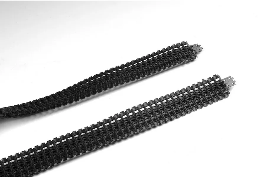 Two black plastic tank tracks for a 1/35 scale model kit laid out on a white background.