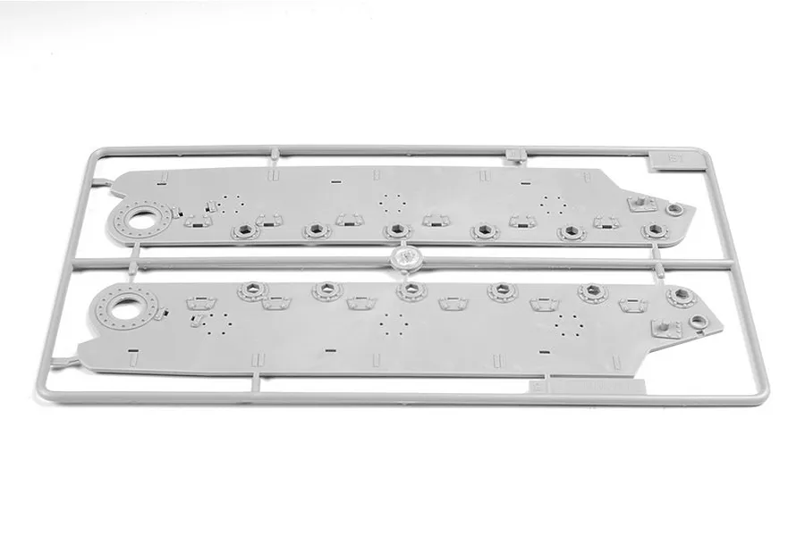 A grey plastic sprue containing two tank hull side panels for a 1/35 scale model kit.
