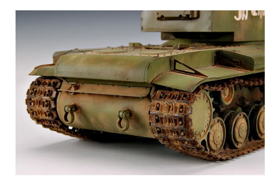 A close-up view of the rear section of a weathered 1/35 scale Russian KV-2 tank model, showing the tracks, hull, and turret base.