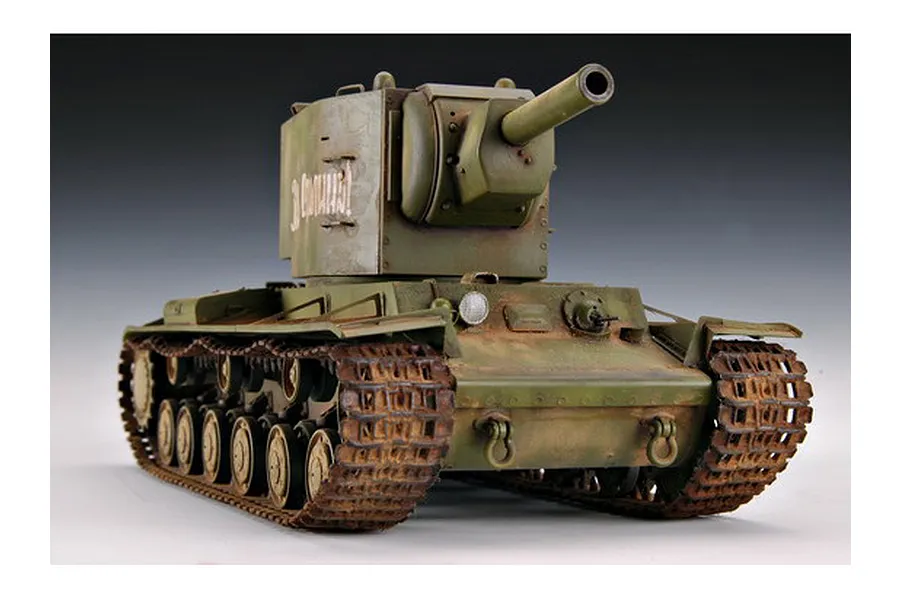 A 1/35 scale model of a Russian KV-2 tank painted in olive green with weathering effects, showing the large turret and tracks.