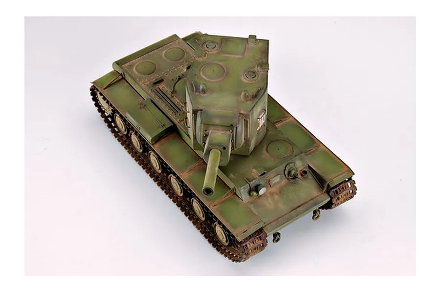 A high-angle studio shot of a fully assembled and painted 1/35 scale Russian KV-2 tank model kit on a white background.