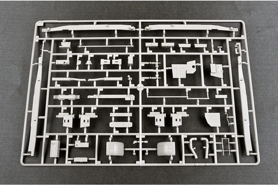 A grey plastic model kit sprue containing various vehicle parts for a 1/35 scale military model.