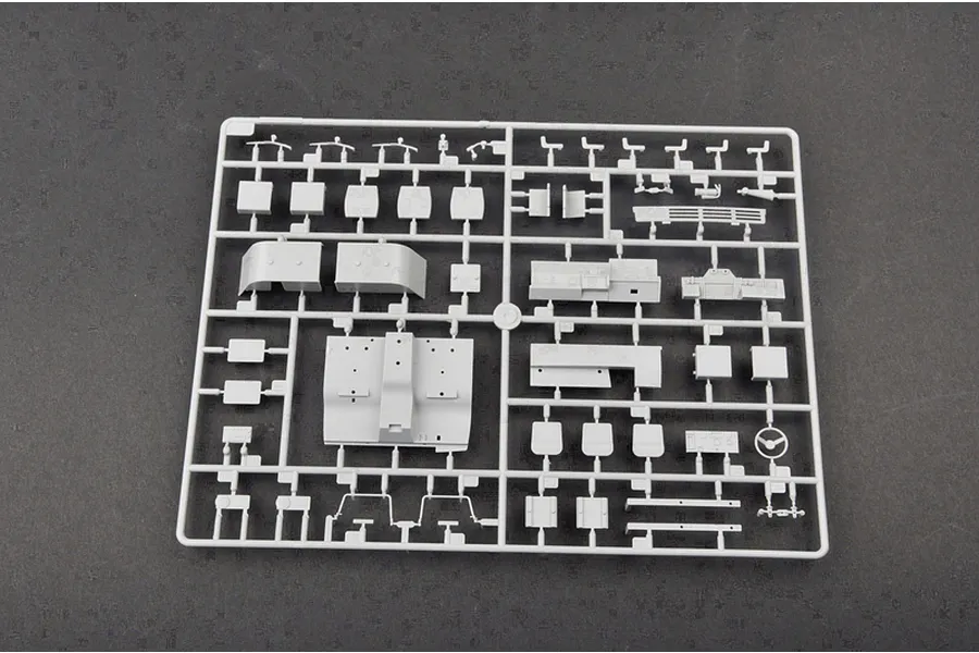 A grey plastic model kit sprue containing various interior and cabin parts for a 1/35 scale military truck model.
