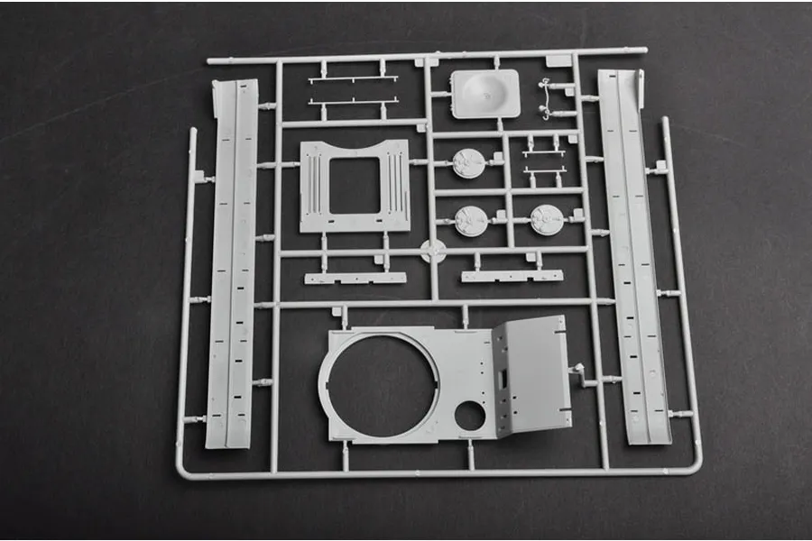 A grey plastic sprue containing various tank model parts for a 1/35 scale Soviet KV-1S heavy tank model kit.