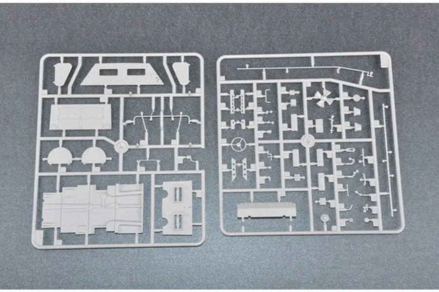 Two grey plastic model kit sprues containing various vehicle parts for a 1/35 scale BTR-60PA model.