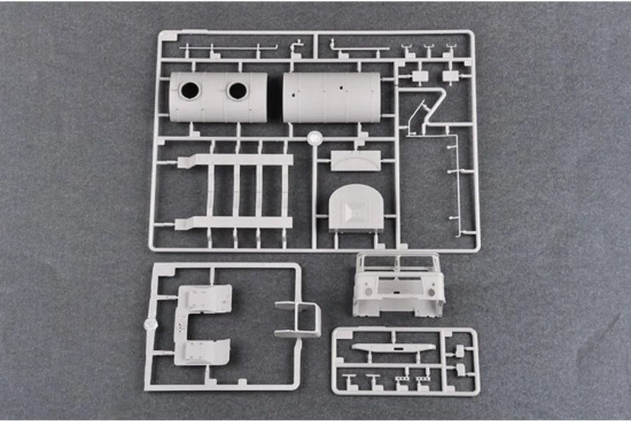 Grey plastic model kit sprues for a 1/35 scale Russian GAZ-66 truck, showing tank sections, chassis parts, and cabin components.