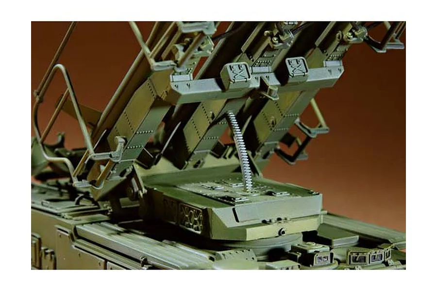 Close-up of a 1/35 scale plastic model of a Russian SAM-6 anti-aircraft missile system, showing the elevated launch rail mechanism.