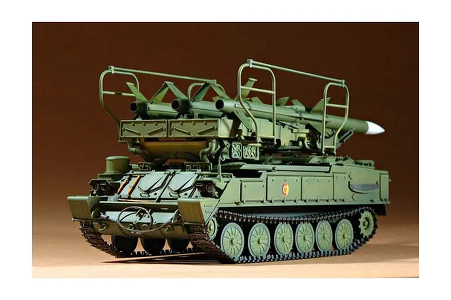 A 1/35 scale plastic model kit of a Russian SAM-6 anti-aircraft missile vehicle, painted in olive green with missiles mounted on top.