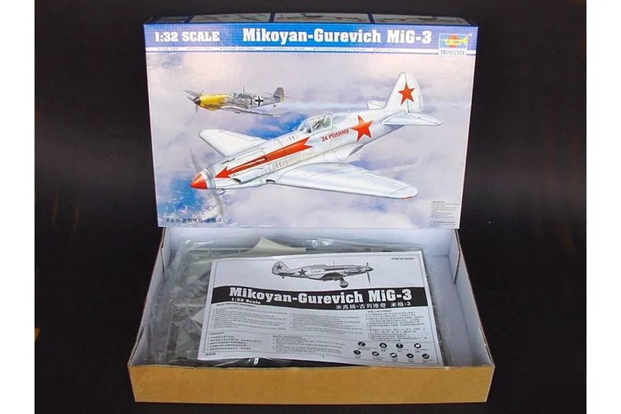 Trumpeter 1/32 scale Mikoyan-Gurevich MiG-3 model kit box open with instruction manual and plastic parts visible inside.