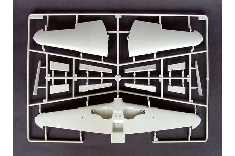 A grey plastic sprue containing model aircraft wing and control surface parts for a 1/32 scale model kit.