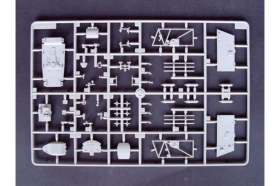A grey plastic sprue containing various unpainted model aircraft parts for a 1/32 scale MiG-3 fighter kit.