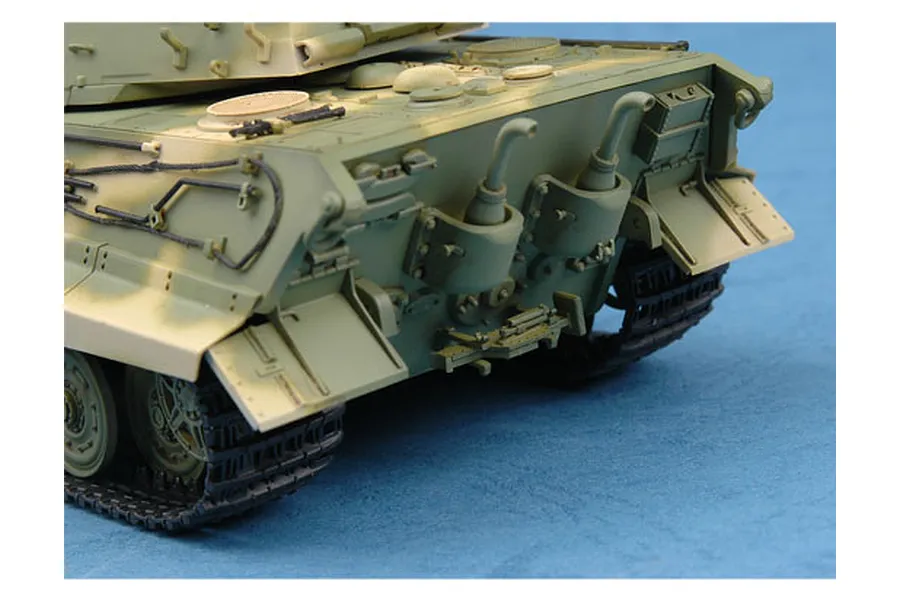Rear view of a 1/35 scale plastic model tank showing engine deck details, exhaust pipes, and tracks against a blue background.
