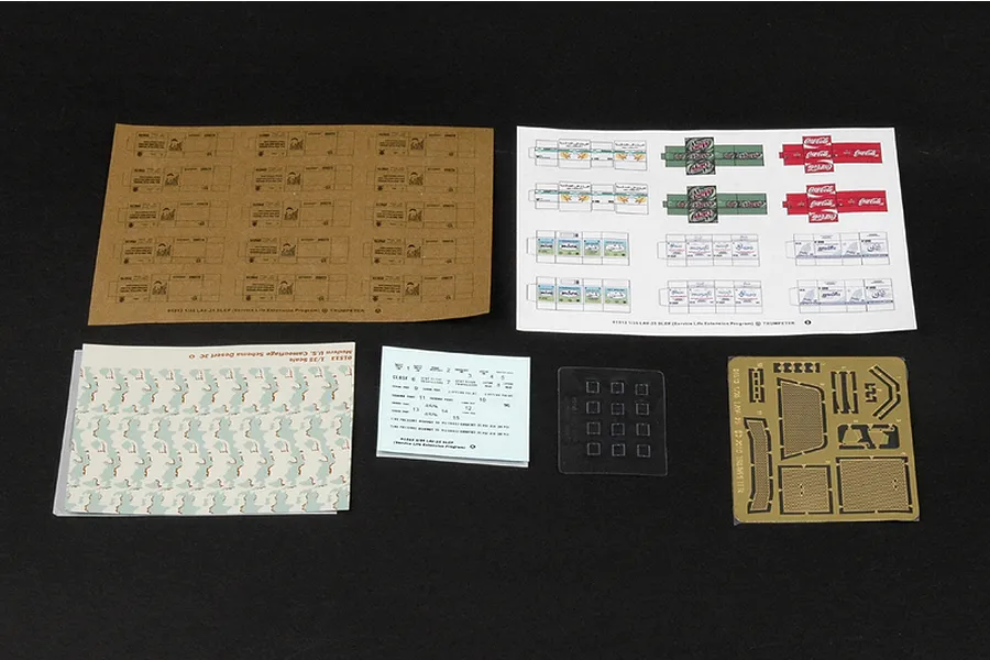 A collection of decal sheets, photo-etched parts, and clear plastic components for the Trumpeter 1/35 LAV-25 SLEP model kit on a black background.