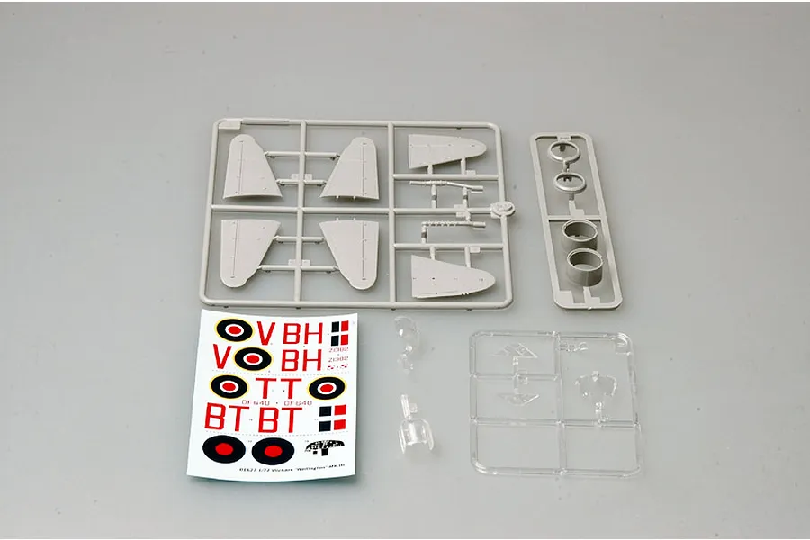 Plastic model kit parts for a 1/72 scale Vickers Wellington Mk. III, including grey sprues, clear parts, and a decal sheet on a grey background.