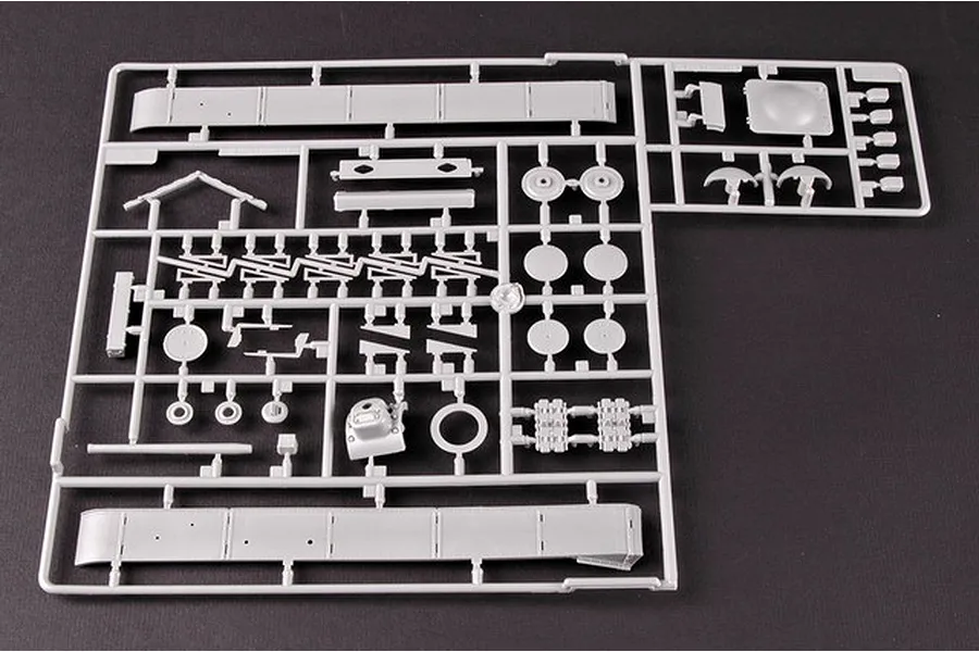 A grey plastic sprue containing various tank model parts for a 1/35 scale KV-1 tank kit.