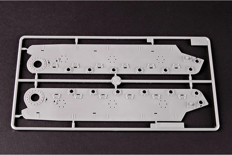 A grey plastic sprue containing two tank hull side panels for a 1/35 scale model kit.