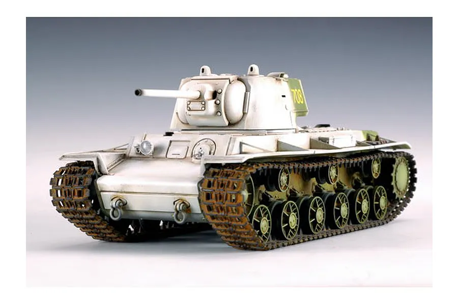 A 1/35 scale model of a Russian KV-1 heavy tank with a white winter camouflage paint scheme and the number 708 on the turret.