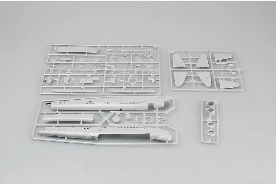 Four grey plastic model kit sprues for a Trumpeter 1/72 scale British Wellington bomber, laid out on a plain light grey background.