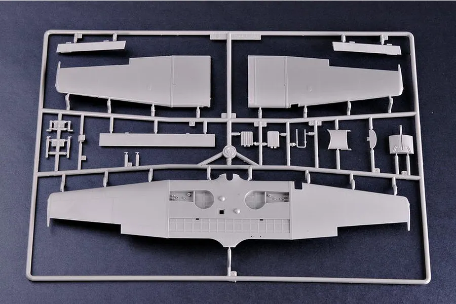 A grey plastic sprue containing various aircraft model parts, including wing sections, for a 1/32 scale model kit.