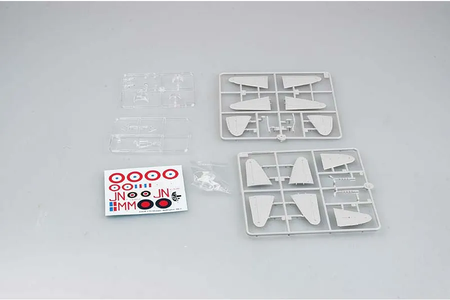 Plastic model kit parts for a 1/72 scale Vickers Wellington bomber, including grey sprues, clear parts, and a decal sheet on a plain background.