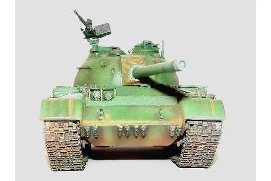 A front-facing view of a 1/35 scale model of a Russian T-54A tank, painted in green camouflage with weathered details.