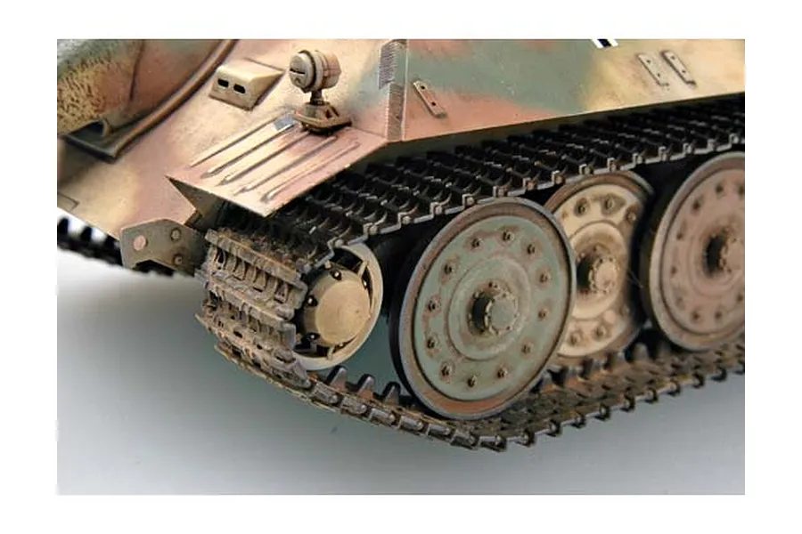 Close-up of the front track and suspension of a camouflaged German E25 tank model kit.