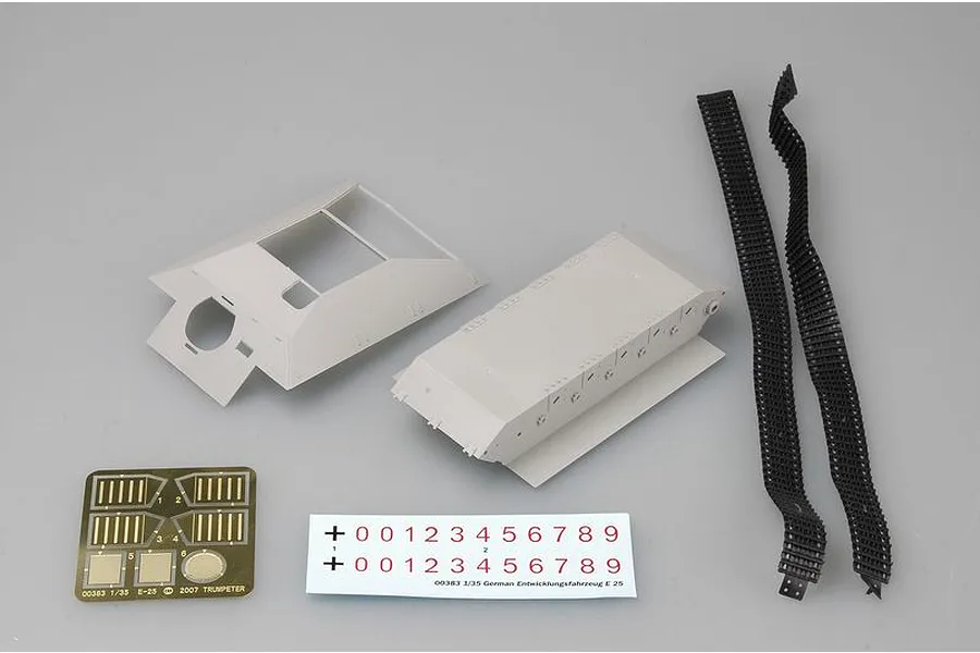 Trumpeter 1/35 scale E25 model kit parts including hull, superstructure, rubber tracks, photo-etched metal sheet, and decal sheet.