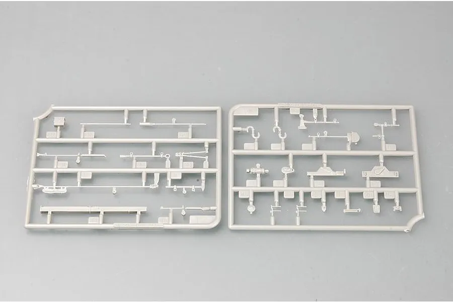 Two grey plastic model kit sprues containing various small parts for a 1/35 scale military vehicle model.