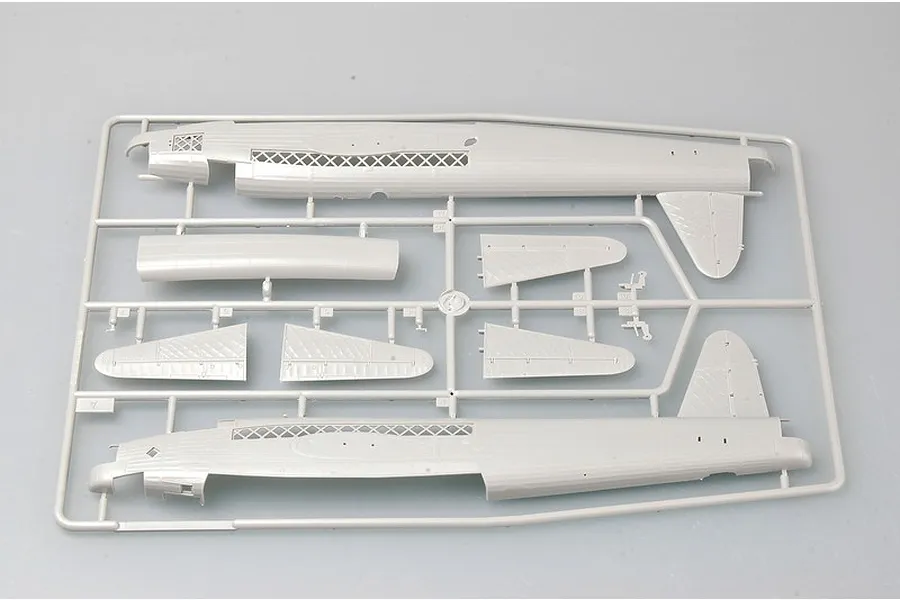 A grey plastic sprue containing fuselage and wing parts for a 1/72 scale model aircraft kit.