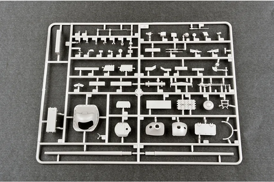 A grey plastic sprue containing various model kit parts for a Soviet SU-101 self-propelled gun.