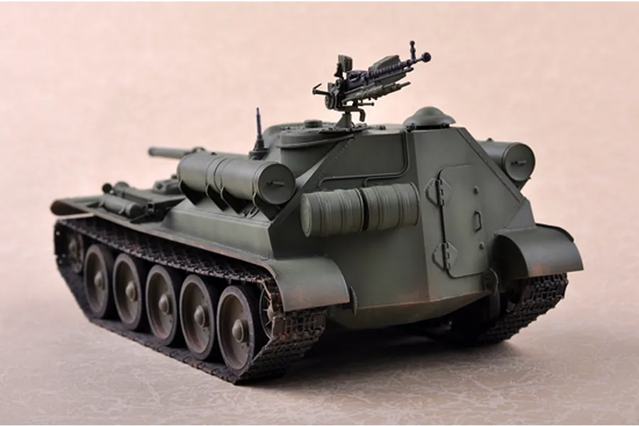 A 1/35 scale model of a Soviet SU-101 self-propelled gun, painted in olive drab, viewed from the rear three-quarter angle.