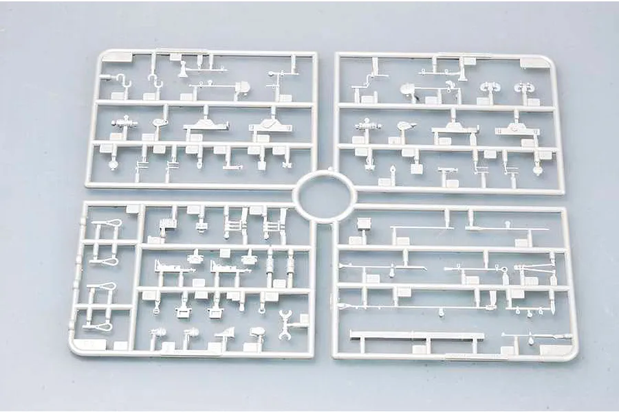 A grey plastic model kit sprue containing various small parts for a 1/35 scale military vehicle model.
