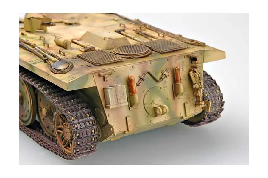 A rear-angle view of a painted and weathered 1/35 scale German E10 tank model kit showing tracks, engine deck, and rear hull details.