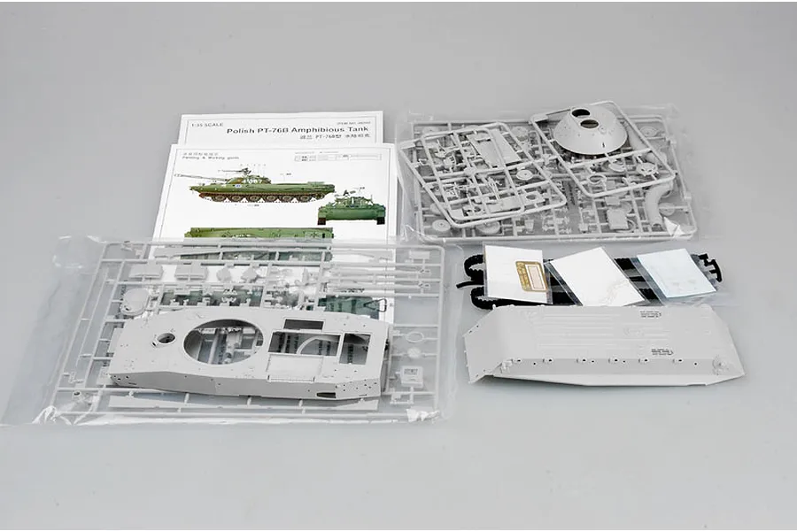 Contents of the Trumpeter 1/35 Polish PT-76B Amphibious Tank model kit, including grey plastic sprues, hull parts, decals, and instruction manual.