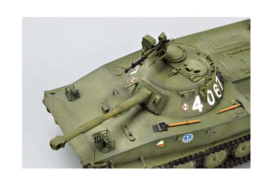 High-angle view of a 1/35 scale model of a Polish PT-76B amphibious tank, showing the turret, main gun, and hull details.