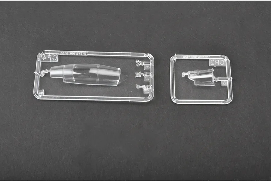 Clear plastic model kit sprues containing the canopy and small parts for a Trumpeter 1/72 scale Russian Su-30MKK model aircraft.