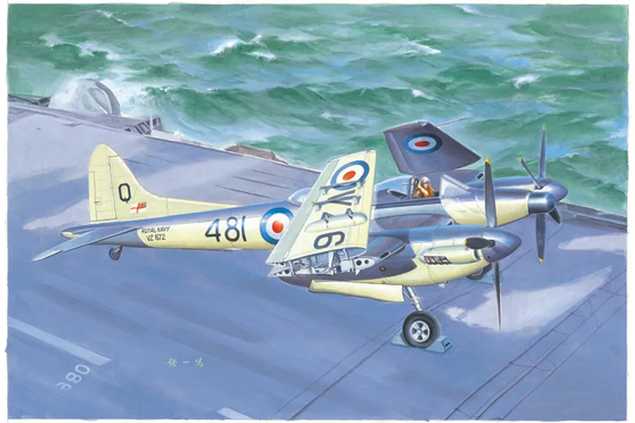 Box art illustration of a De Havilland Sea Hornet NF.21 fighter aircraft parked on an aircraft carrier deck at sea.