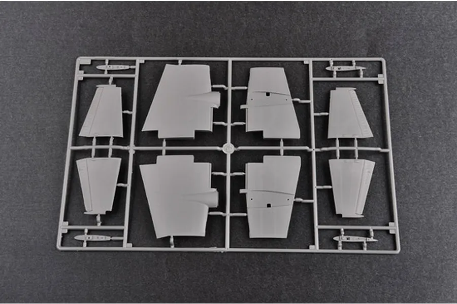 A grey plastic sprue containing various aircraft wing and control surface components for a 1/48 scale model kit.