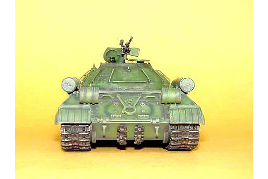 Front view of a 1/35 scale plastic model of a Russian IS-3M heavy tank, painted in olive green with weathered details.