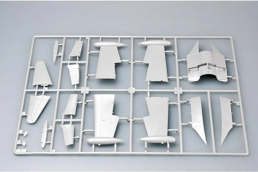 A grey plastic sprue containing various aircraft wing and fuselage components for a 1/48 scale model kit.
