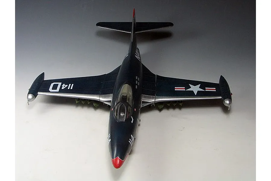 Top-down view of a finished 1/48 scale Trumpeter F9F-3 Panther model jet in dark blue US Navy livery.