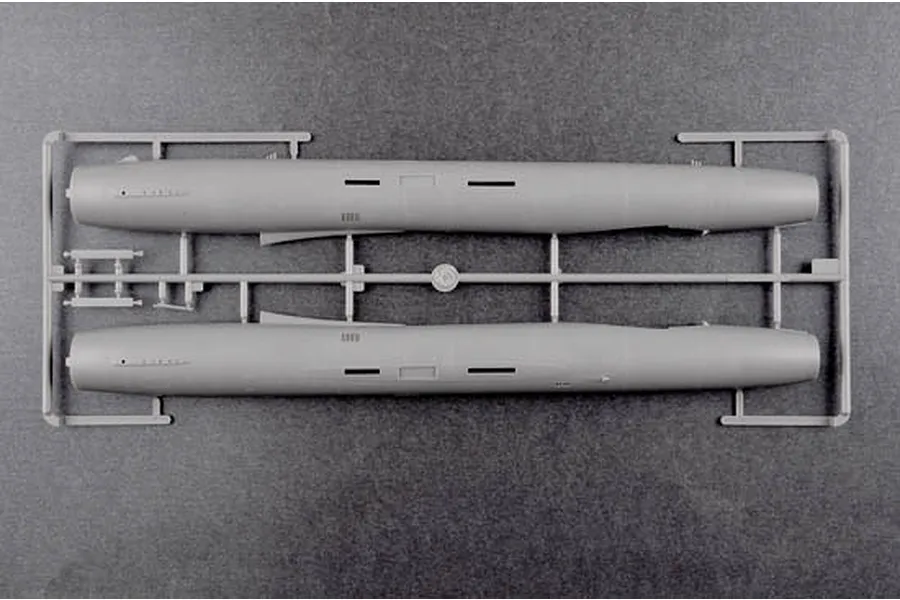 A grey plastic model kit sprue containing two fuselage halves for a 1/48 scale aircraft model.