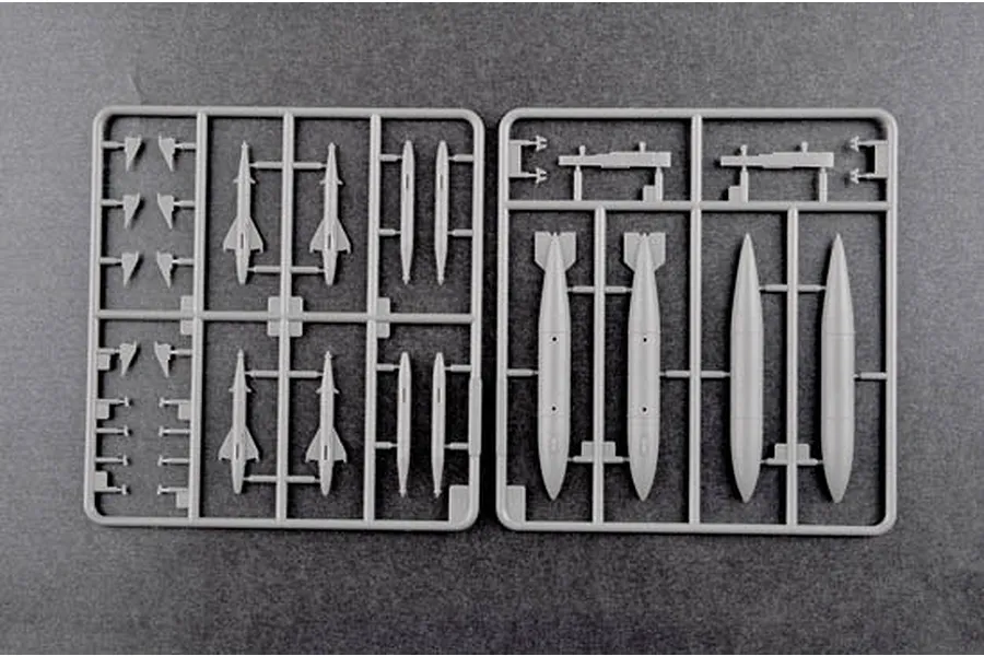 Two grey plastic model kit sprues containing various missile and fuel tank components for a 1/48 scale aircraft model.